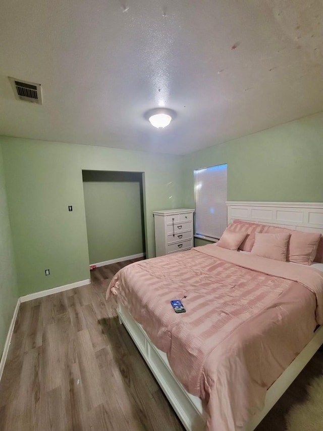 bedroom featuring hardwood / wood-style floors