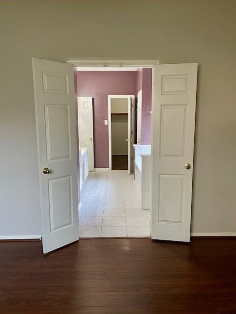 corridor featuring wood-type flooring