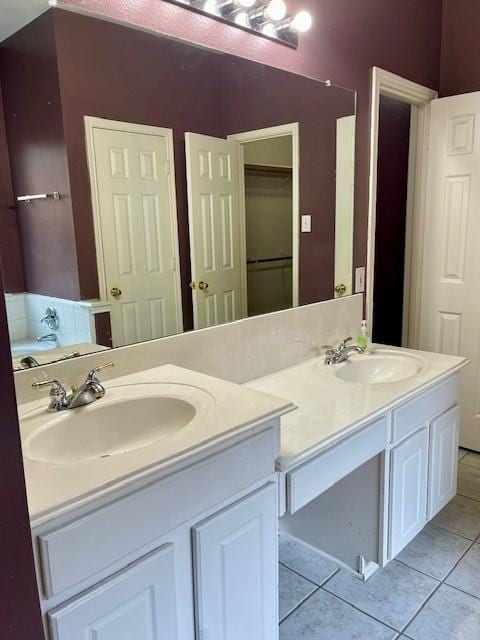 bathroom with tile patterned flooring and vanity