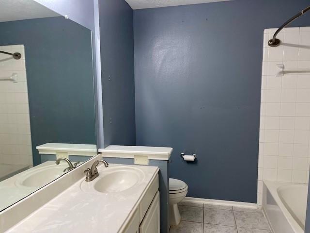 full bathroom with tile patterned floors, vanity, toilet, and tiled shower / bath