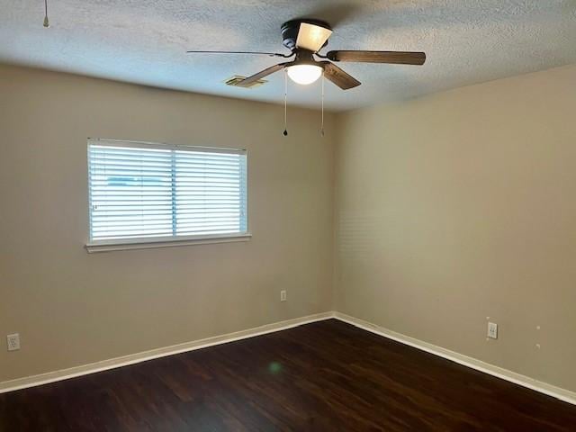 empty room featuring wood-type flooring, a textured ceiling, and ceiling fan