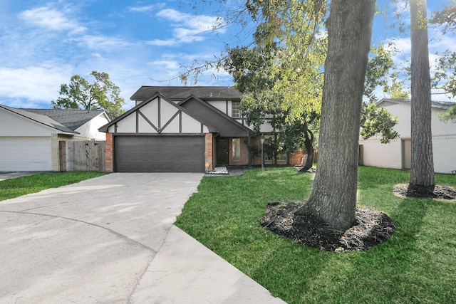 view of front of house with a front yard and a garage