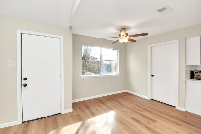 entryway with light wood-type flooring and ceiling fan