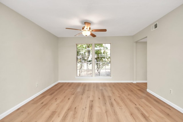 unfurnished room with ceiling fan and light hardwood / wood-style flooring