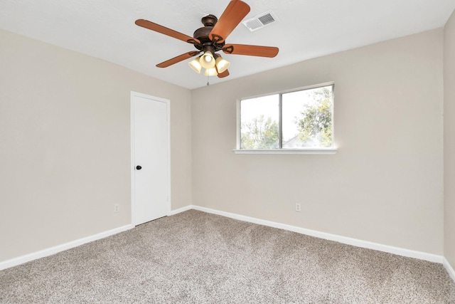 carpeted empty room featuring ceiling fan