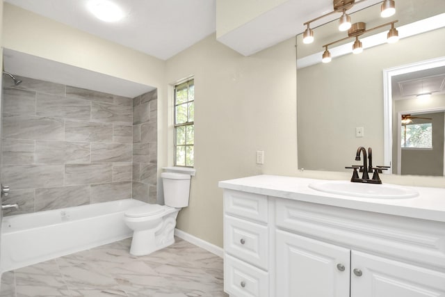 full bathroom with vanity, toilet, and tiled shower / bath