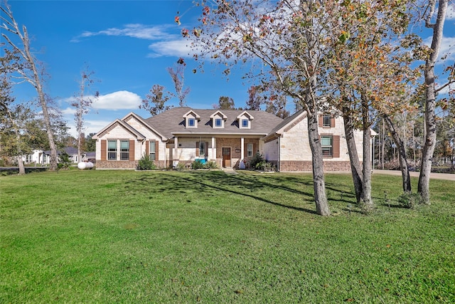 cape cod house with a front lawn