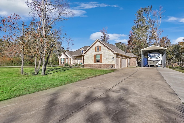 view of front of property featuring a carport, a garage, and a front yard