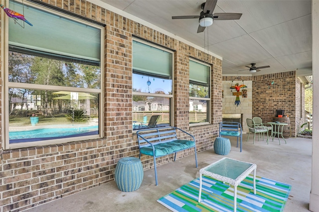 view of patio / terrace featuring ceiling fan