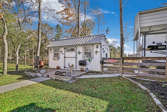 view of outbuilding with a lawn