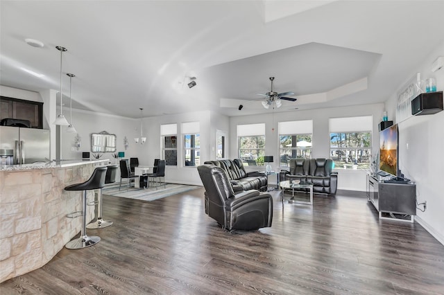 living room featuring ceiling fan and dark wood-type flooring