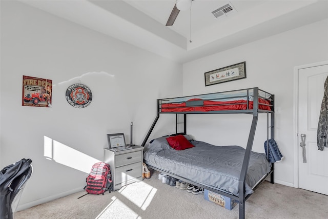 bedroom featuring ceiling fan and light carpet