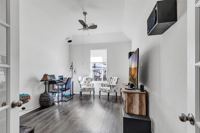 interior space with a towering ceiling, dark hardwood / wood-style flooring, and ceiling fan