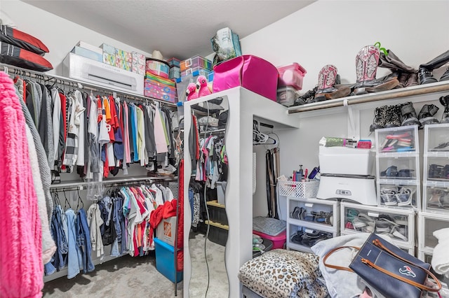 spacious closet with carpet flooring