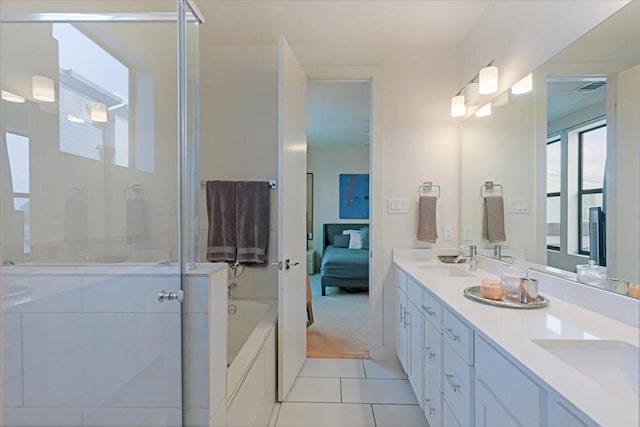 bathroom with tile patterned floors, vanity, and plus walk in shower