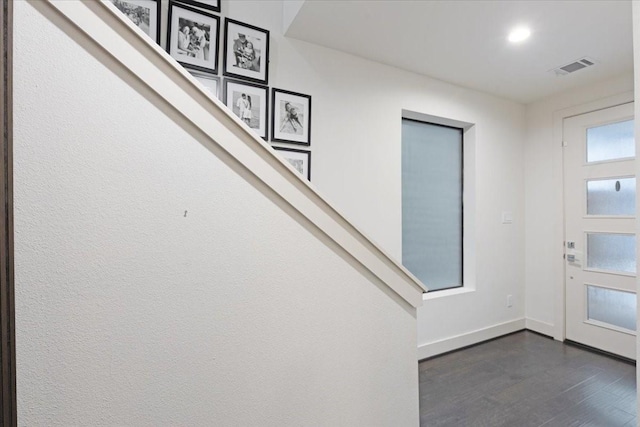 foyer entrance featuring dark hardwood / wood-style flooring