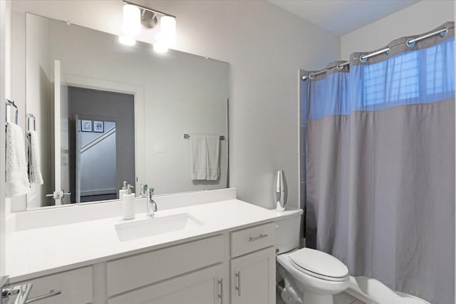 bathroom with vanity, toilet, and walk in shower