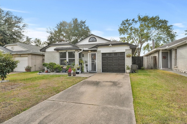 ranch-style home with a garage and a front lawn