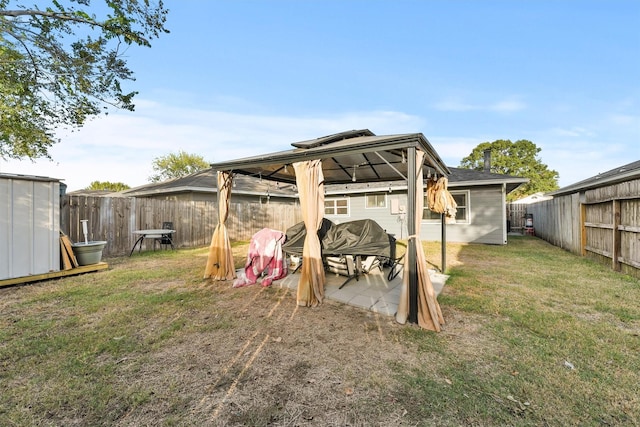 view of yard featuring a gazebo and a patio area