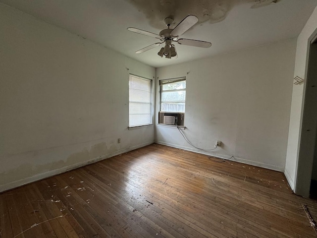 unfurnished room featuring dark hardwood / wood-style flooring, ceiling fan, and cooling unit