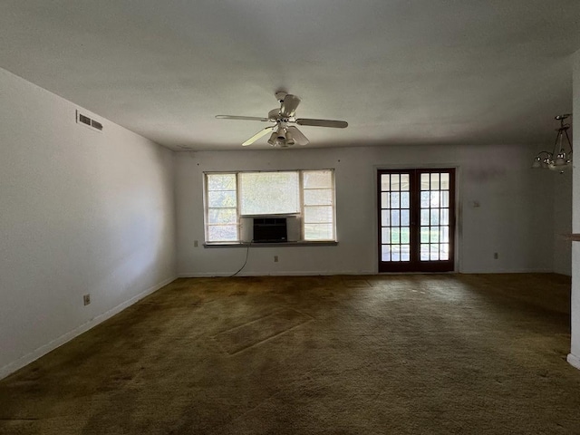 unfurnished living room with dark colored carpet, french doors, and ceiling fan