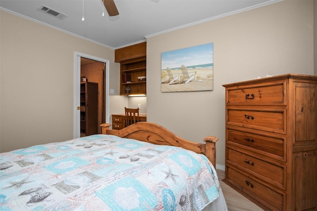 bedroom with ceiling fan, crown molding, and light hardwood / wood-style flooring