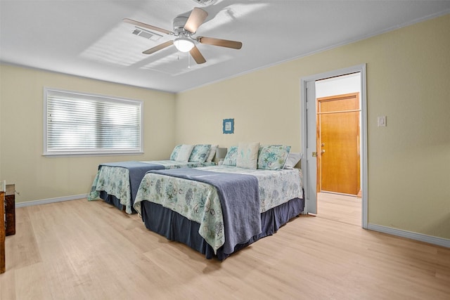 bedroom featuring light hardwood / wood-style floors and ceiling fan