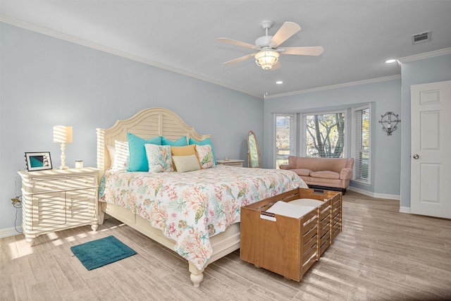 bedroom featuring ceiling fan, light wood-type flooring, and ornamental molding