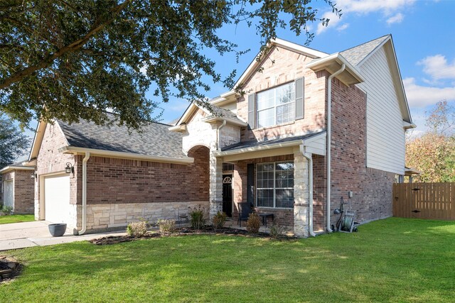 view of front of house with a garage and a front lawn