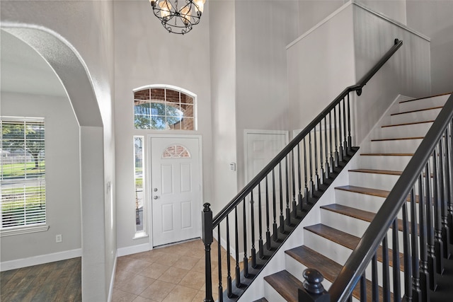 tiled foyer entrance with a high ceiling