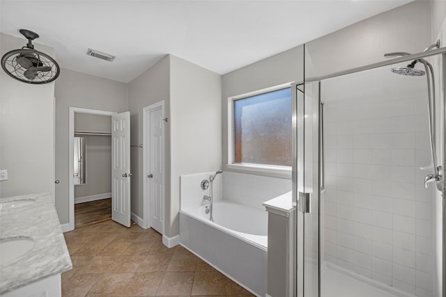 bathroom featuring vanity and separate shower and tub