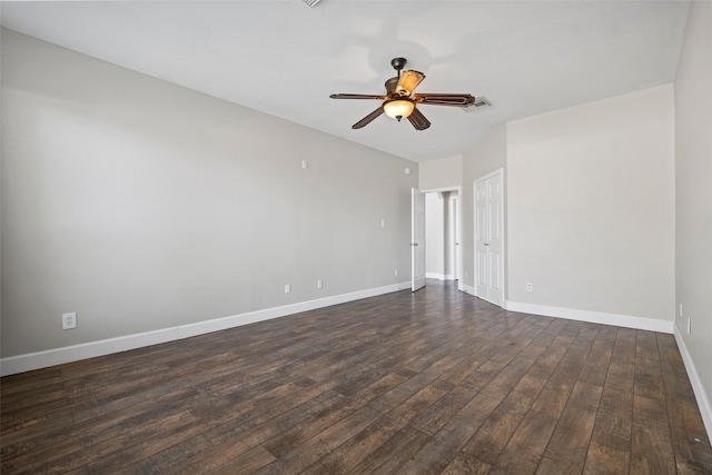 unfurnished room with dark wood-type flooring and ceiling fan