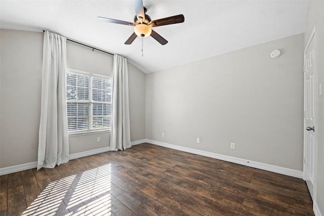 spare room with ceiling fan, lofted ceiling, and dark hardwood / wood-style flooring