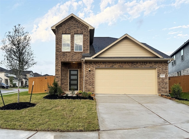 view of property with a front yard and a garage