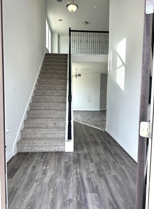 staircase featuring hardwood / wood-style floors