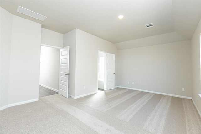 interior space featuring carpet and lofted ceiling