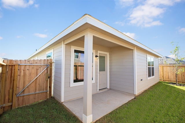 exterior space featuring a yard and a patio