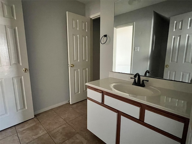 bathroom with tile patterned flooring and vanity