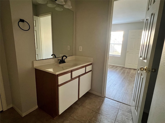 bathroom with vanity and hardwood / wood-style flooring