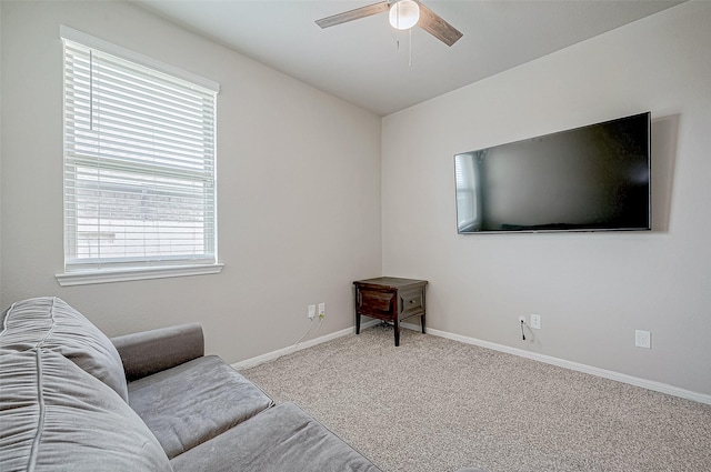 living room featuring carpet flooring and ceiling fan