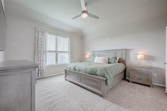 carpeted bedroom with ceiling fan and lofted ceiling