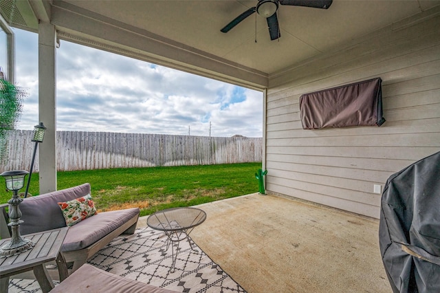 view of patio featuring ceiling fan