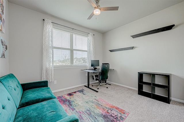 office space featuring ceiling fan and light colored carpet