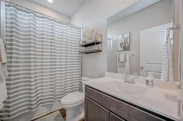 full bathroom with shower / bathtub combination with curtain, vanity, toilet, and hardwood / wood-style floors