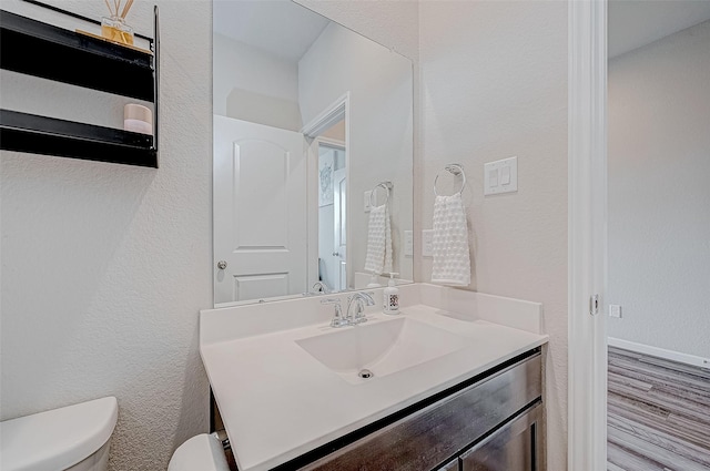 31407 Calle Linda Dr, Hockley, TX 77447 - half bathroom featuring toilet, vanity, and wood finished floors
