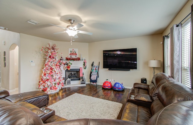 living room featuring ceiling fan and wood-type flooring