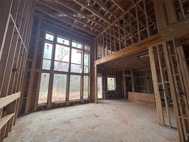 miscellaneous room featuring a towering ceiling