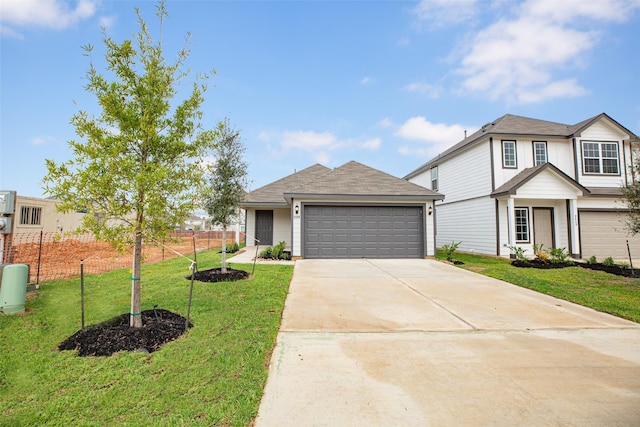 view of front facade featuring a front yard and a garage