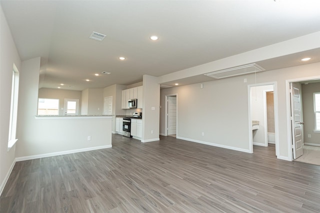 unfurnished living room with light wood-type flooring