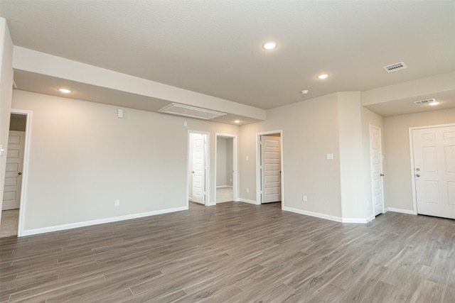 spare room with hardwood / wood-style floors